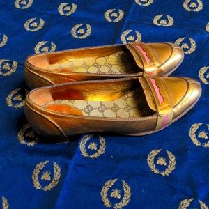 Women Gucci golden loafers